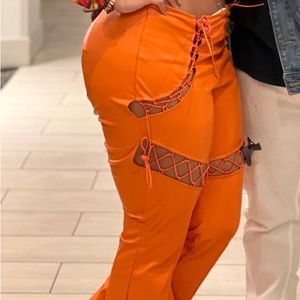 Orange tie up stretch pants with flare leg
